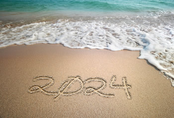 Image de voeux avec le numéro 2024 écrit dans le sable